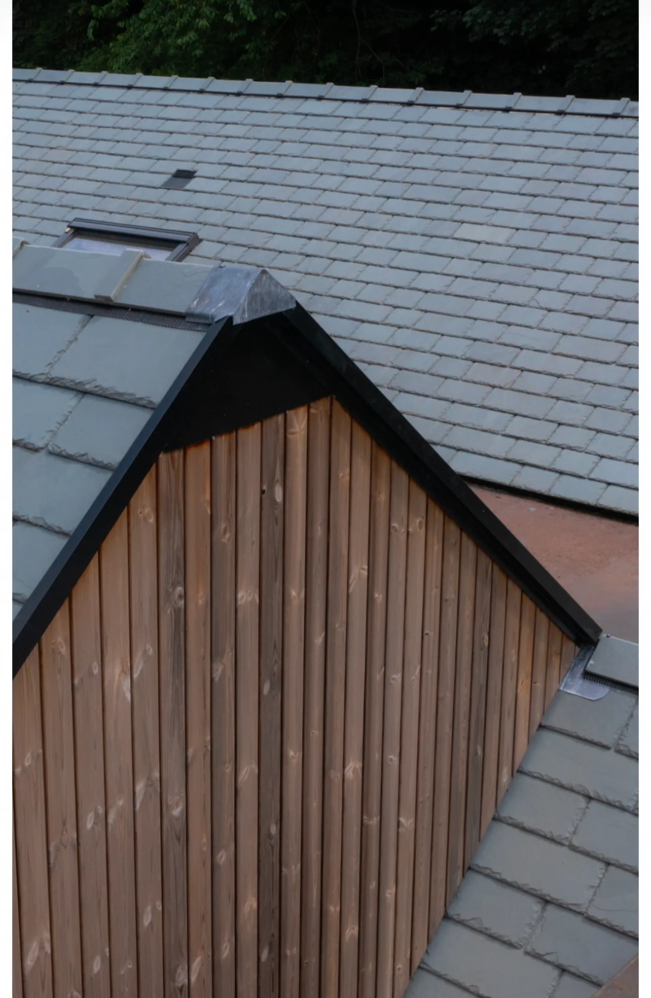 Natural slate detailing across the bespoke new build roof