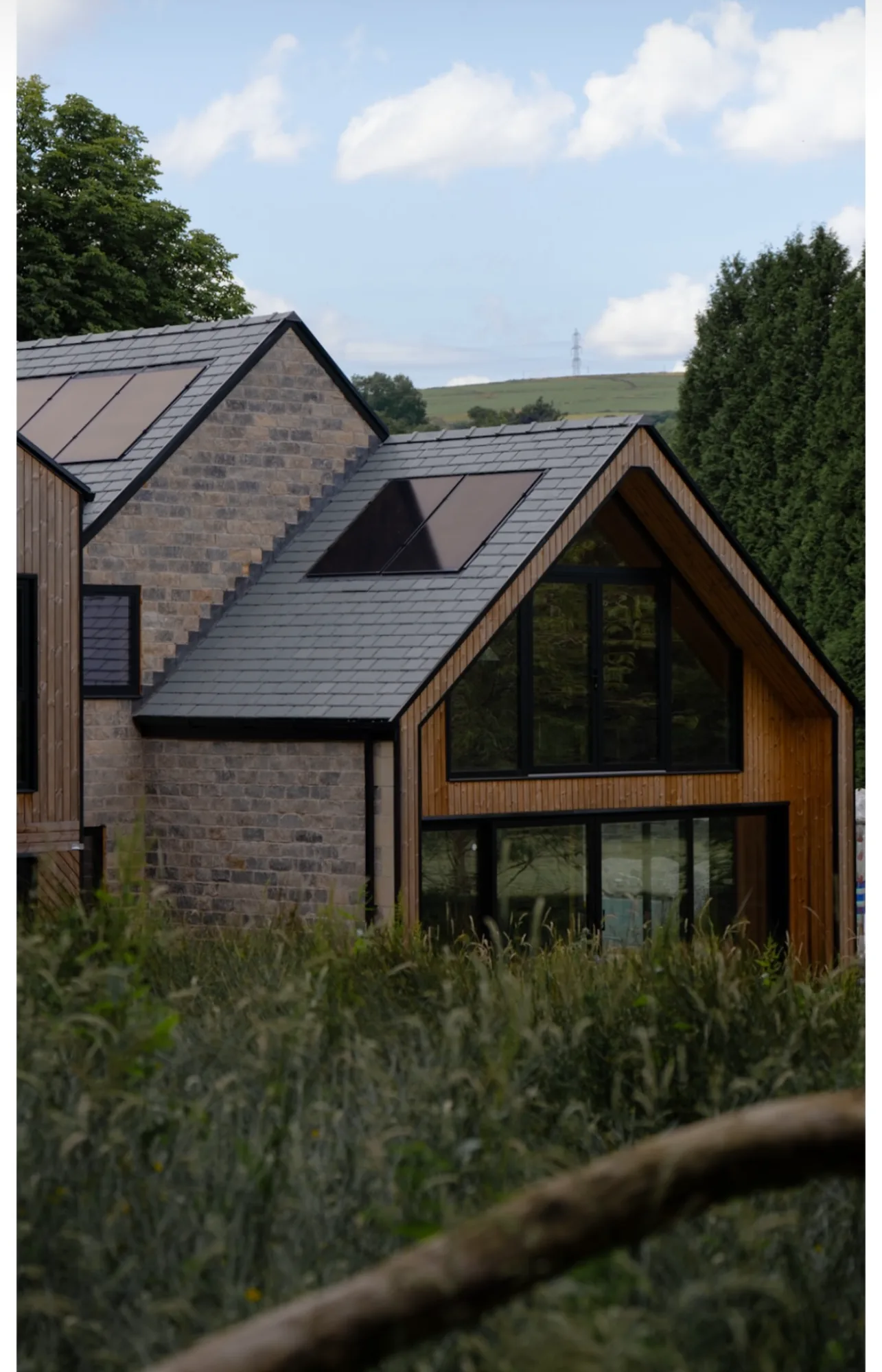 Finished bespoke slate roof with copper dormers and integrated solar