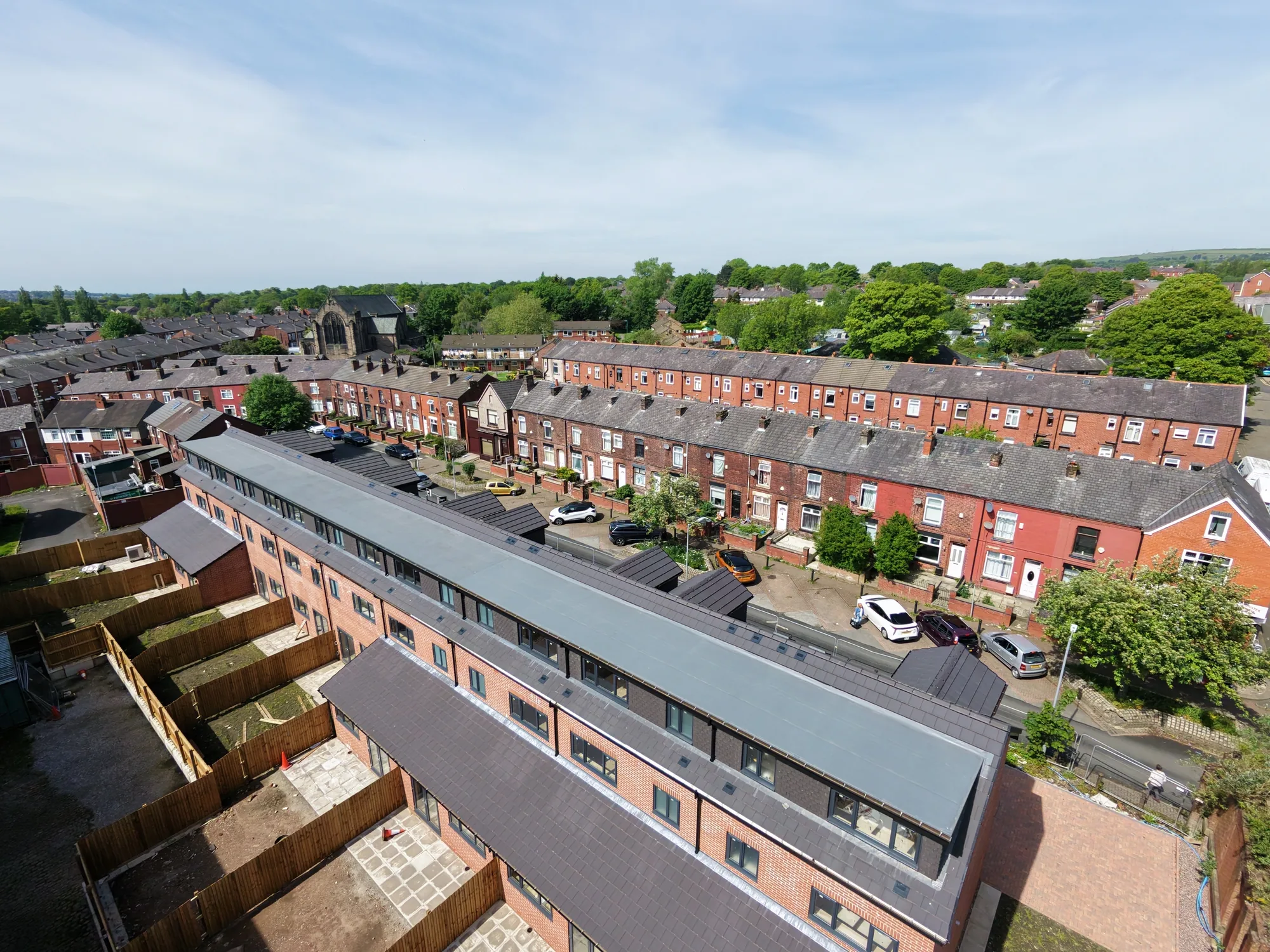 New-build homes with new tiled pitched roofs on the Greater Manchester