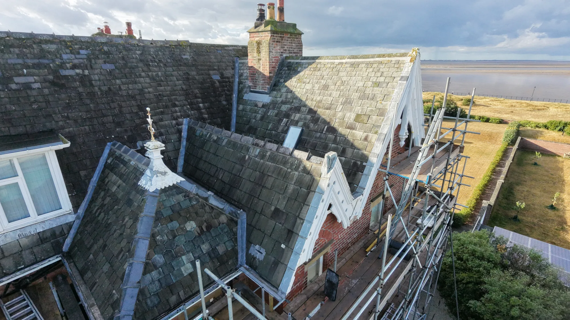 Aerial view of the completed ornamental slate re-roof overlooking the Fylde Coast