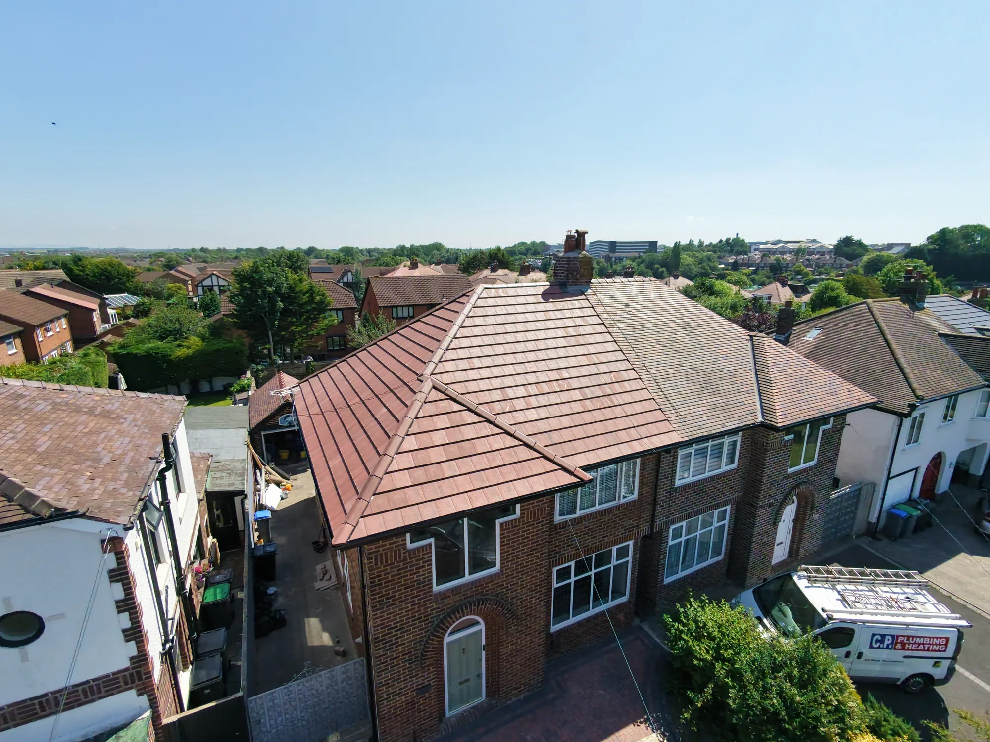 Rebuilt ridge chimney on a completed re-roof