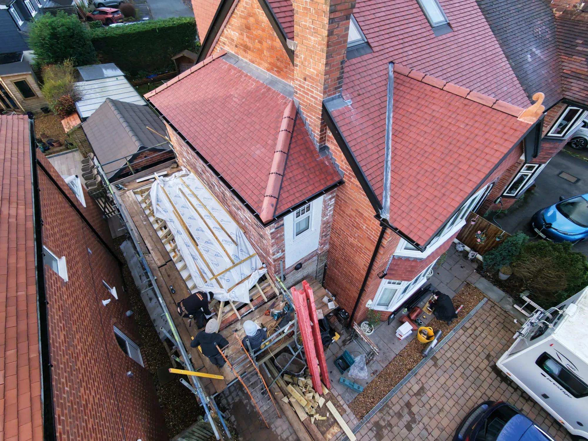 Extension roof repair with new tiles and membrane