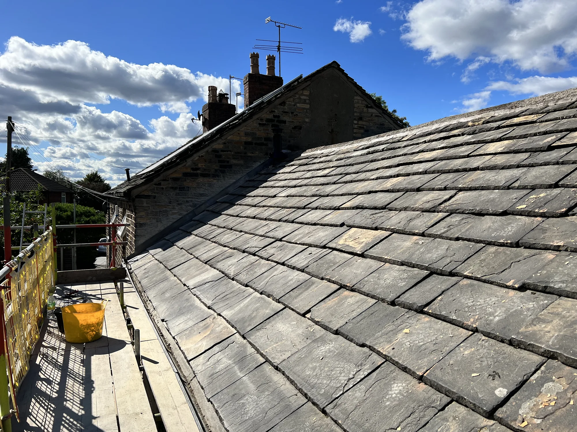Traditional stone slate roof re-laid in diminishing courses