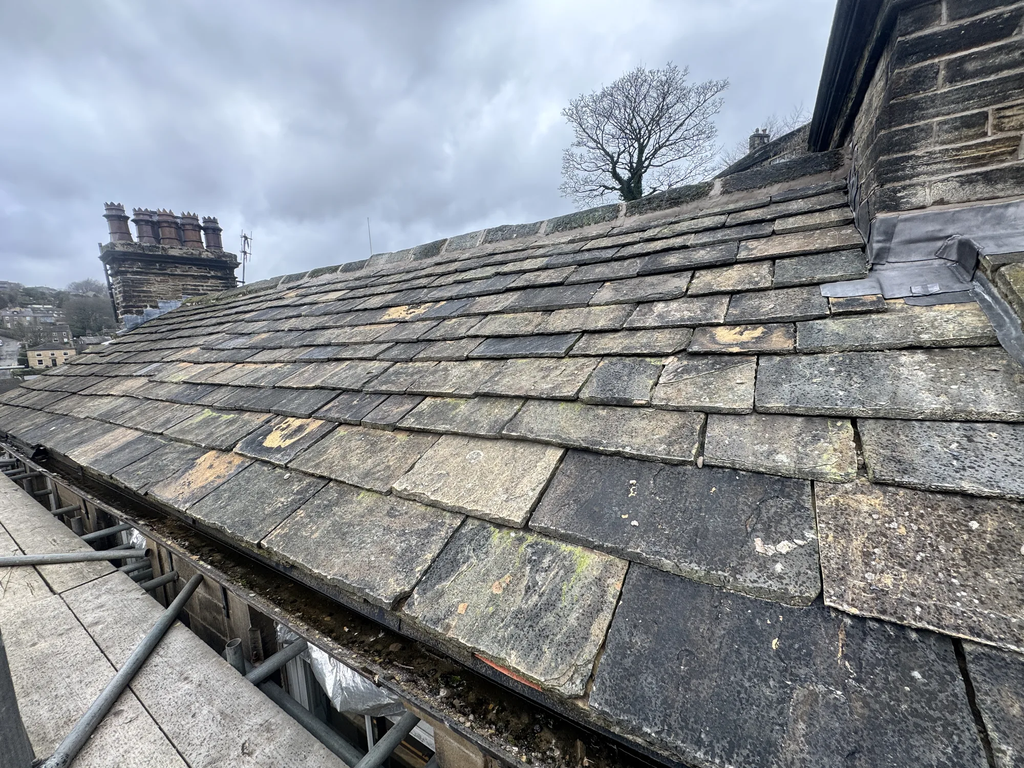 Traditional stone slate roof by The Roofers Blackpool