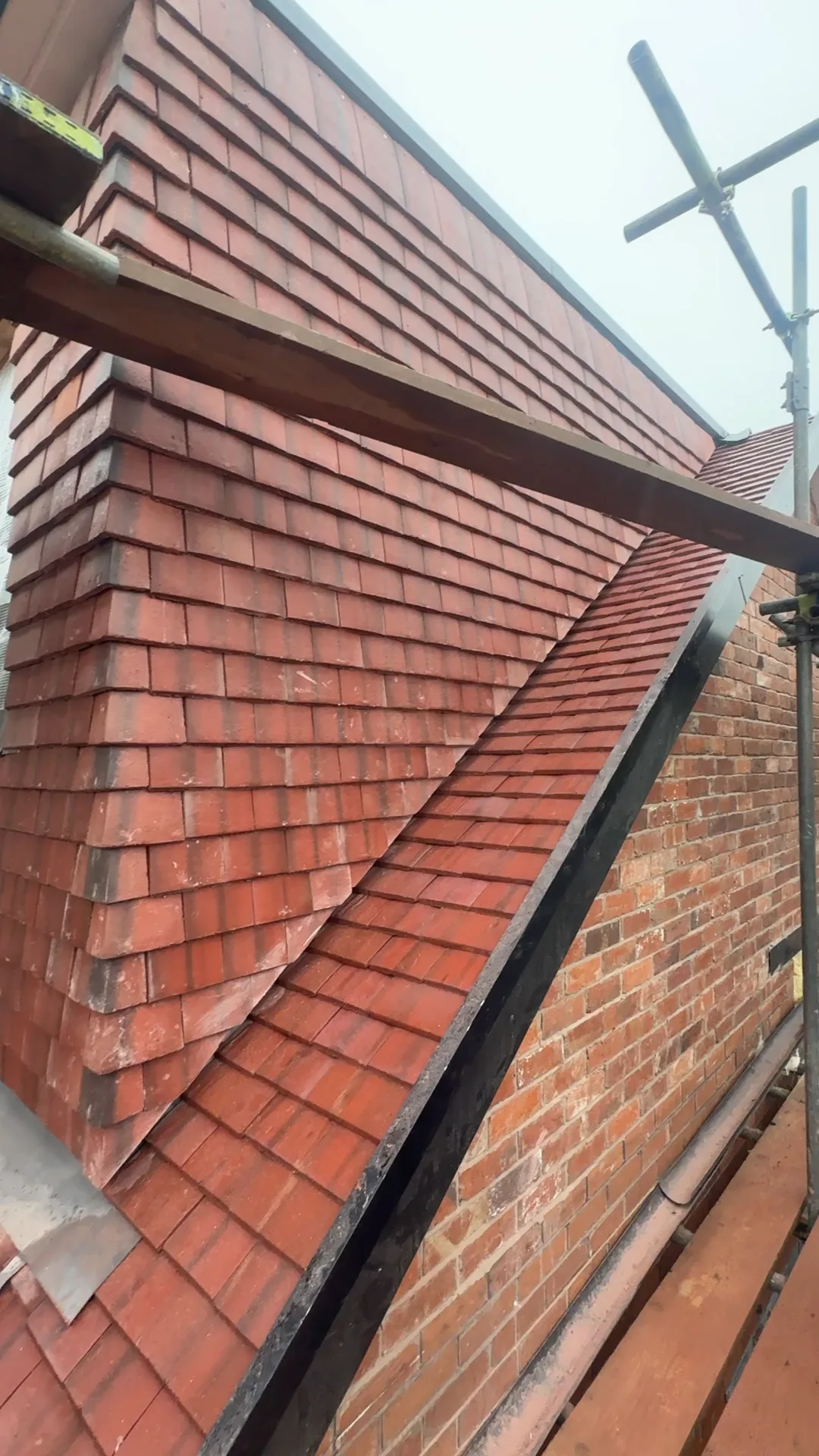 Close-up of detailed new clay tile roofing with valley and hip work by The Roofers Blackpool